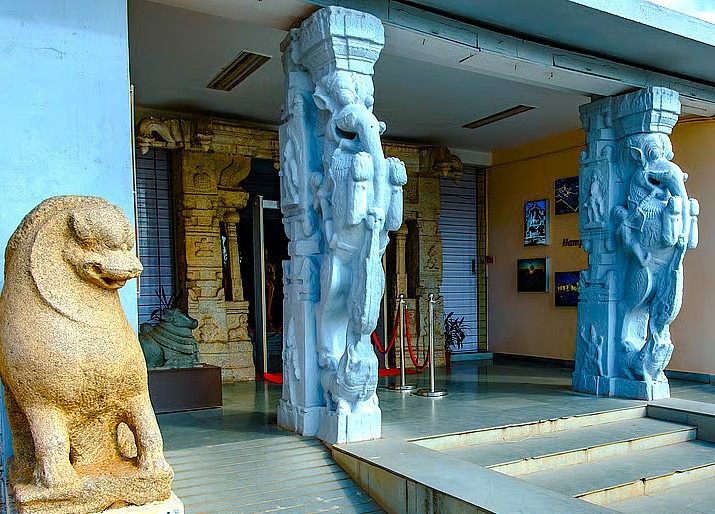 The Hampi Archaeological Museum entrance welcomes visitors to the UNESCO site in Karnataka, India, providing context for the Vittala Temple, Queen's Baths, Sanapur Lake, and attractions near Hippie Island. The Hampi Archaeological Museum entrance welcomes visitors to the UNESCO site in Karnataka, India, providing context for the Vittala Temple, Queen's Baths, Sanapur Lake, and attractions near Hippie Island.