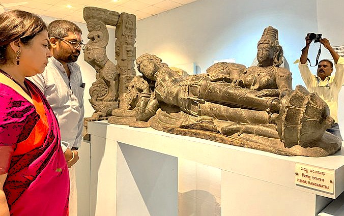 A gallery within the Hampi Archaeological Museum showcases sculptures like Hanuman at the UNESCO site in Karnataka, India, near Vittala Temple, Queen's Baths, Sanapur Lake, and Hippie Island. A gallery within the Hampi Archaeological Museum showcases sculptures like Hanuman at the UNESCO site in Karnataka, India, near Vittala Temple, Queen's Baths, Sanapur Lake, and Hippie Island.