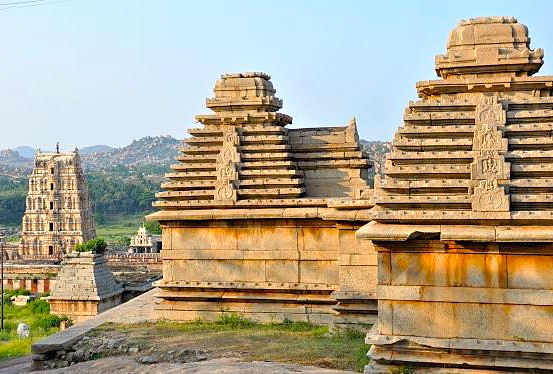 The view from Hemakuta Hill at the Hampi Unesco site in Karnataka, India, showcases ancient temples, while the larger complex includes the royal Elephant stables and queens baths.