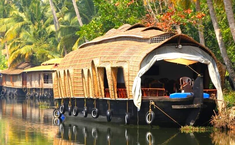 Traditional Kettuvallam Houseboats Kerala drift near Kochi through lush backwaters, surrounded by coconut palms, offering authentic South India luxury cruising, serene river views, tropical ambiance, and picture-perfect charming waterfront landscapes. Traditional Kettuvallam Houseboats Kerala drift near Kochi through lush backwaters, surrounded by coconut palms, offering authentic South India luxury cruising, serene river views, tropical ambiance, and picture-perfect charming waterfront landscapes.