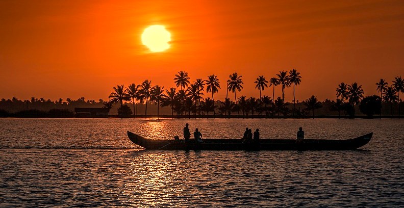Serene Kettuvallam Houseboats Kerala glide near Kochi along Kerala’s backwaters at sunset, framed by swaying palm trees and calm waters, showcasing South India’s tranquil tropical charm and picturesque riverside beauty. Serene Kettuvallam Houseboats Kerala glide near Kochi along Kerala’s backwaters at sunset, framed by swaying palm trees and calm waters, showcasing South India’s tranquil tropical charm and picturesque riverside beauty.