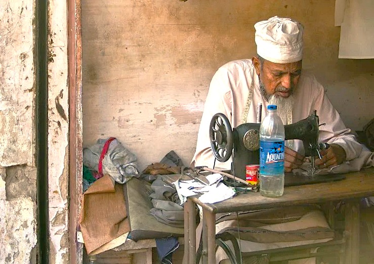 A local tailor works at his sewing machine in Hubli, Karnataka, India, a stop near Utsav Rock Garden on a road trip near-Goa's Unesco Churches, Hubli. A local tailor works at his sewing machine in Hubli, Karnataka, India, a stop near Utsav Rock Garden on a road trip near-Goa's Unesco Churches, Hubli.