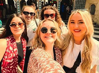 A group of young women tourists take a selfie in Hubli, Karnataka, India, a key stop near Utsav Rock Garden on a road trip near-Goa's Unesco Churches, Hubli. A group of young women tourists take a selfie in Hubli, Karnataka, India, a key stop near Utsav Rock Garden on a road trip near-Goa's Unesco Churches, Hubli.