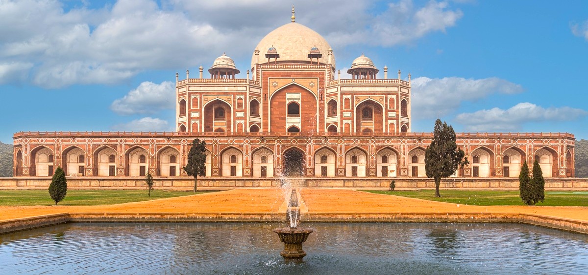 Humayans Tomb in New Delhi, India boasts crimson sandstone facades, symmetrical Mughal design, central marble dome, reflective water channels, lush terraces, UNESCO heritage status, iconic cultural landmark and historical masterpiece. Humayans Tomb in New Delhi, India boasts crimson sandstone facades, symmetrical Mughal design, central marble dome, reflective water channels, lush terraces, UNESCO heritage status, iconic cultural landmark and historical masterpiece.