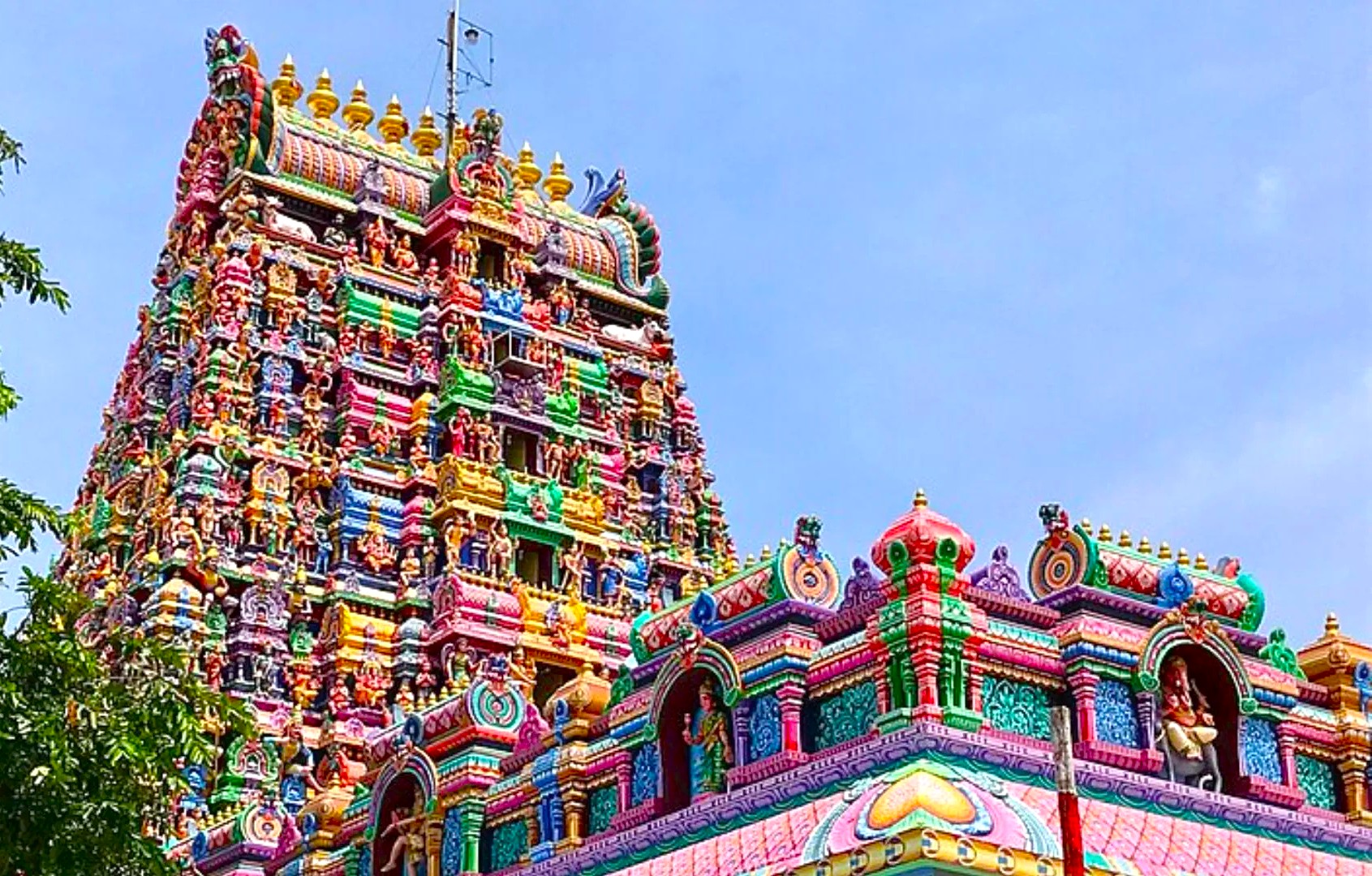 Vibrant South Indian Hindu temple gopuram in Kerala, India, showcases ornate carvings and deities, drawing travelers from Munnar and Kochi to Varanasi’s ghats, Taj Mahal, Mysore palaces, Bangalore gardens, Mumbai markets, Delhi landmarks, Madurai shrines. Vibrant South Indian Hindu temple gopuram in Kerala, India, showcases ornate carvings and deities, drawing travelers from Munnar and Kochi to Varanasi’s ghats, Taj Mahal, Mysore palaces, Bangalore gardens, Mumbai markets, Delhi landmarks, Madurai shrines.