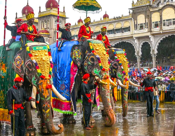 Colorful Kerala festival procession with elaborately decorated elephants in Mysore during India tour, blending Munnar tea landscapes, Kochi heritage, Bangalore modernity and Madurai temple traditions. Colorful Kerala festival procession with elaborately decorated elephants in Mysore during India tour, blending Munnar tea landscapes, Kochi heritage, Bangalore modernity and Madurai temple traditions.