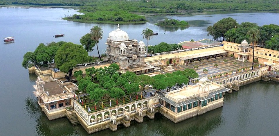 “Jag Mandir island palace on Lake Pichola in Udaipur, Rajasthan, India, enchants visitors with marble domes, lush gardens, historic Rajput architecture, serene boat rides, cultural heritage tours, panoramic lake views.”  “Jag Mandir island palace on Lake Pichola in Udaipur, Rajasthan, India, enchants visitors with marble domes, lush gardens, historic Rajput architecture, serene boat rides, cultural heritage tours, panoramic lake views.”