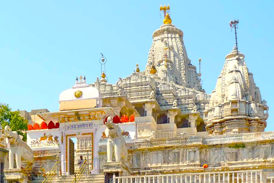 Devotees visit UNESCO-recognized Jagdish Temple, Udaipur, Rajasthan, India, admiring intricate carvings, sacred rituals, ancient architecture, cultural heritage, and spiritual continuity in regional Hindu worship, hosting family gatherings and community celebrations.
