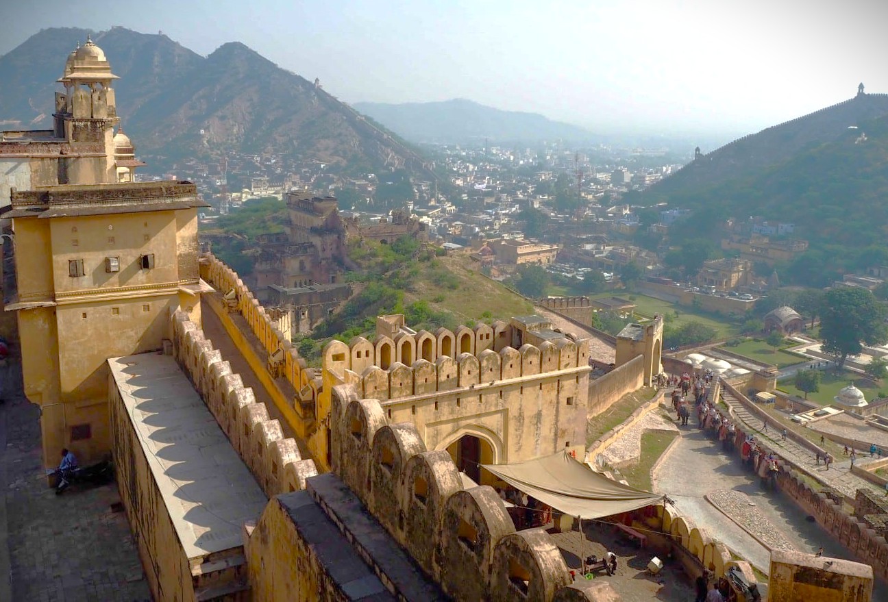 Ancient Amber Fort in Jaipur, Rajasthan, India, a UNESCO World Heritage site perched on the Aravalli hills, overlooks a vibrant cityscape with intricate sandstone ramparts, palaces, and grand Rajput courtyards. Ancient Amber Fort in Jaipur, Rajasthan, India, a UNESCO World Heritage site perched on the Aravalli hills, overlooks a vibrant cityscape with intricate sandstone ramparts, palaces, and grand Rajput courtyards.