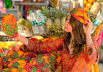 A smiling tourist shops for colorful handicrafts and textiles in the streets near Jamia Masjid Srinagar, celebrating the city's UNESCO Creative Arts culture in Jammu and Kashmir, Indi A smiling tourist shops for colorful handicrafts and textiles in the streets near Jamia Masjid Srinagar, celebrating the city's UNESCO Creative Arts culture in Jammu and Kashmir, Indi