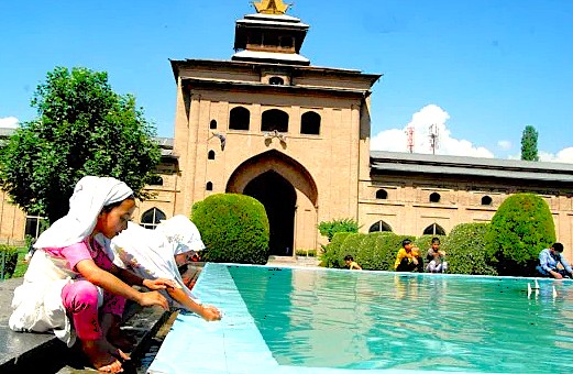 washing their hands at the ritual ablution pond outside the historic Jamia Masjid Srinagar, a spiritual and architectural landmark recognized for UNESCO Creative Arts in Jammu and Kashmir, India. washing their hands at the ritual ablution pond outside the historic Jamia Masjid Srinagar, a spiritual and architectural landmark recognized for UNESCO Creative Arts in Jammu and Kashmir, India.