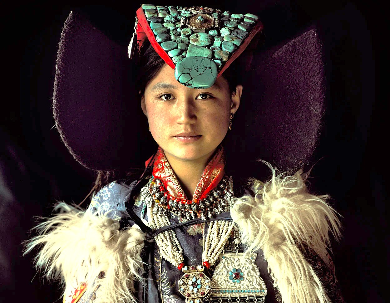 A portrait of a woman in elaborate traditional dress and jewelry, showcasing the rich UNESCO Creative Arts culture near Jamia Masjid Srinagar in Jammu and Kashmir, India. A portrait of a woman in elaborate traditional dress and jewelry, showcasing the rich UNESCO Creative Arts culture near Jamia Masjid Srinagar in Jammu and Kashmir, India.