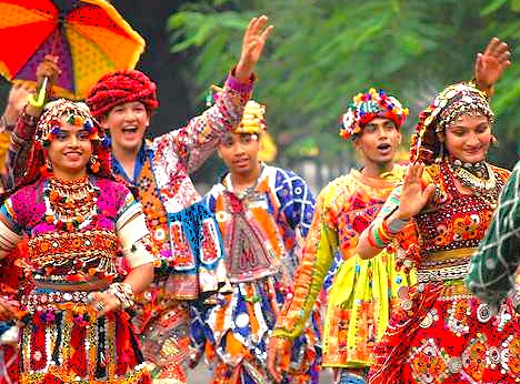  “Vibrant traditional dancers in colorful attire celebrate rich Rajasthani culture near Jantar Mantar Jaipur in Rajasthan, India, at a UNESCO World Heritage Site festival, showcasing joyful folk dance and heritage.”