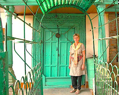 A visitor stands at the bright green door of the controversial Jesus Tomb (Roza Bal shrine) in Kashmir-Srinagar, India, a site of spiritual interest near Shankaracharya Hill and the mighty Himalayas, reflecting the region's unique heritage. A visitor stands at the bright green door of the controversial Jesus Tomb (Roza Bal shrine) in Kashmir-Srinagar, India, a site of spiritual interest near Shankaracharya Hill and the mighty Himalayas, reflecting the region's unique heritage.