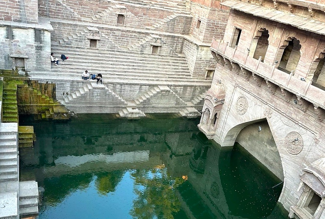 Ancient stone stepwell in Jodhpur, the Blue city of Rajasthan, India showcases intricate carvings, moss-covered walls, and serene emerald water, inviting visitors to explore timeless traditional architecture and heritage beauty. Ancient stone stepwell in Jodhpur, the Blue city of Rajasthan, India showcases intricate carvings, moss-covered walls, and serene emerald water, inviting visitors to explore timeless traditional architecture and heritage beauty.