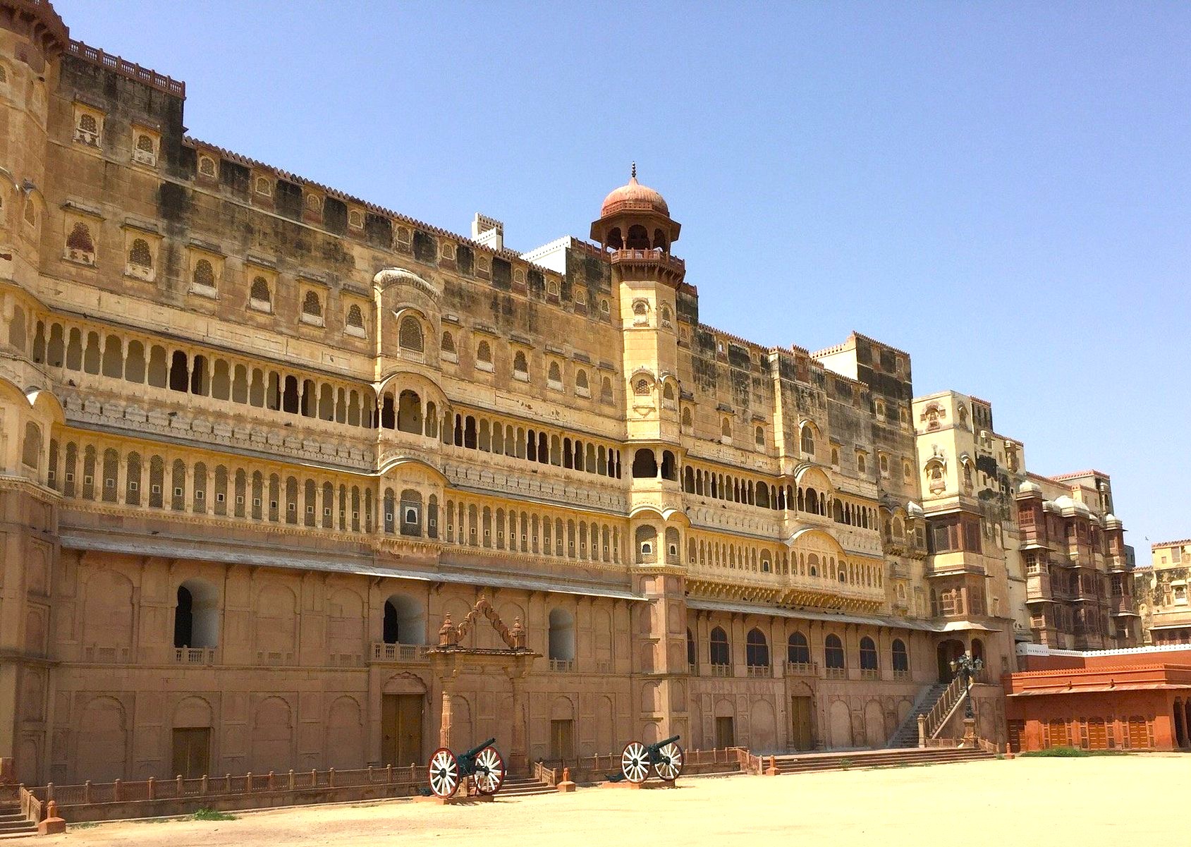 Junagarh Fort Bikaner stands as a majestic sandstone fortress in the heart of Rajasthan, India, overlooking the golden dunes of the Thar Desert, showcasing Mughal and Rajput timeless architectural splendor. Junagarh Fort Bikaner stands as a majestic sandstone fortress in the heart of Rajasthan, India, overlooking the golden dunes of the Thar Desert, showcasing Mughal and Rajput timeless architectural splendor.