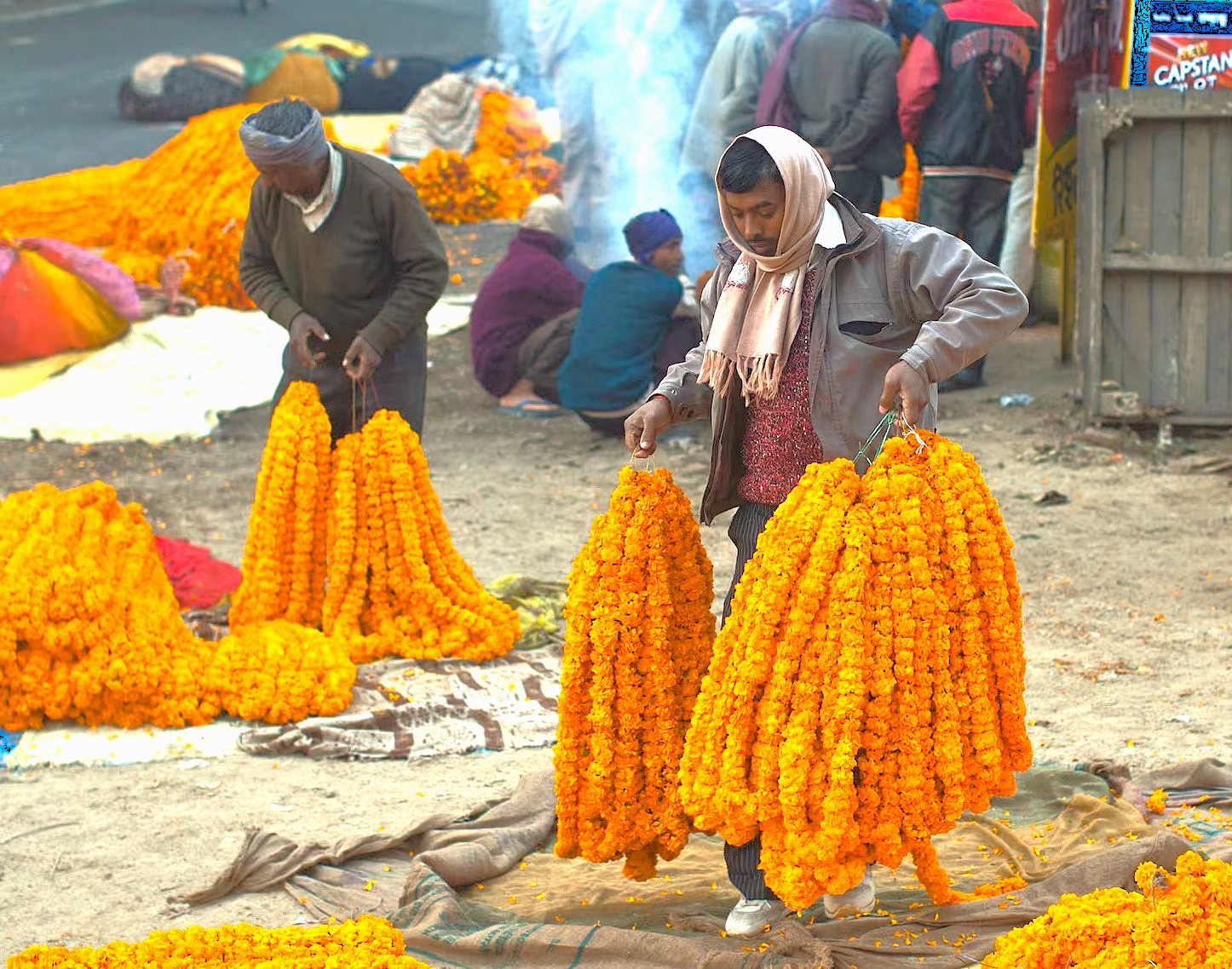 “Colorful marigold garlands at a bustling flower market near ISKCON Temple Bangalore, Karnataka, India, close to Mysore Palace, showcasing vibrant cultural traditions, street vendors, festival decorations, and authentic daily craftsmanship.” “Colorful marigold garlands at a bustling flower market near ISKCON Temple Bangalore, Karnataka, India, close to Mysore Palace, showcasing vibrant cultural traditions, street vendors, festival decorations, and authentic daily craftsmanship.”