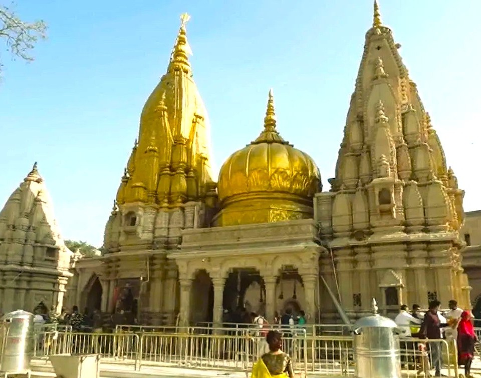 The magnificent golden spires of the sacred Kashi Vishwanath Temple dominate the skyline in Varanasi, India, close to the Sarnath UNESCO World Heritage Site. The magnificent golden spires of the sacred Kashi Vishwanath Temple dominate the skyline in Varanasi, India, close to the Sarnath UNESCO World Heritage Site.