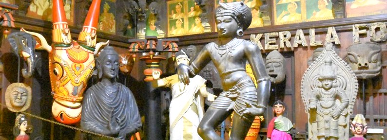 “Energetic display of traditional masks, statues and costumes at the Kerala Folklore Museum Kochi highlights South India, Kerala cultural heritage, ritual art forms, regional crafts, Kerala folklore preservation and exhibits.” “Energetic display of traditional masks, statues and costumes at the Kerala Folklore Museum Kochi highlights South India, Kerala cultural heritage, ritual art forms, regional crafts, Kerala folklore preservation and exhibits.”