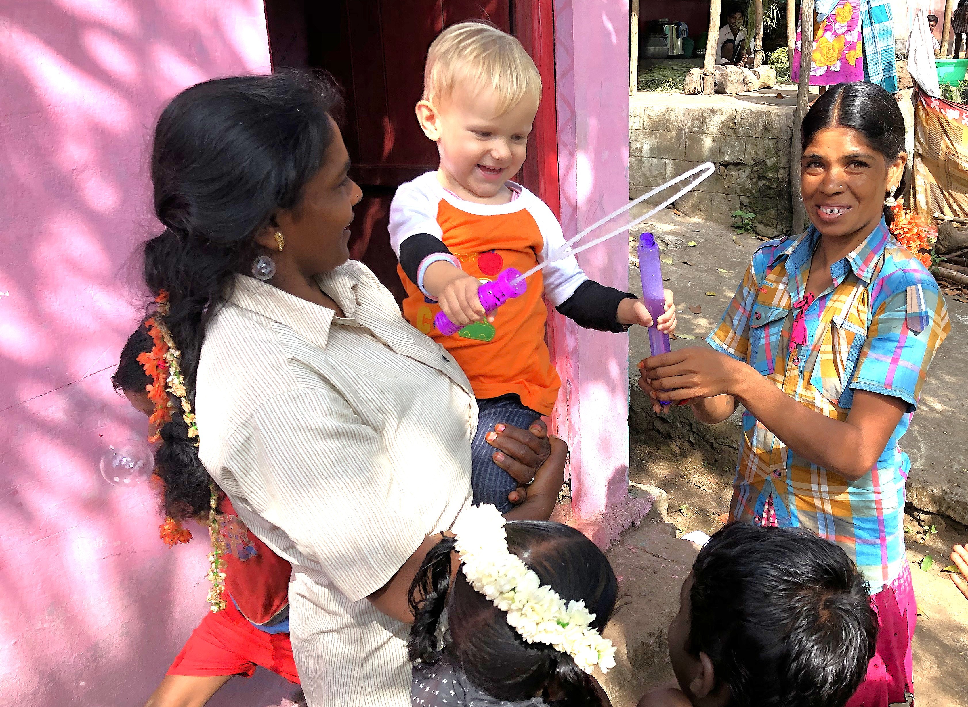 Kids Health India Smokeless Stove Project volunteers engage Tamil Nadu families in Kodaikanal’s Palani Hills, South India, fostering clean cooking, community joy, and children’s well-being.