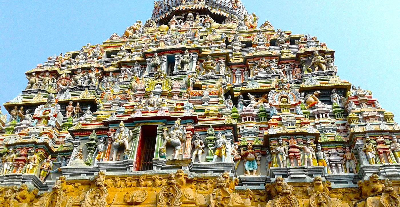 Intricately carved, vibrant Dravidian gopuram of Koodal Azhagar Temple in Madurai, Tamil Nadu, South India showcases centuries-old Vishnu iconography, elaborate ornate temple sculptures, historic sacred pilgrimage heritage and architectural splendor. Intricately carved, vibrant Dravidian gopuram of Koodal Azhagar Temple in Madurai, Tamil Nadu, South India showcases centuries-old Vishnu iconography, elaborate ornate temple sculptures, historic sacred pilgrimage heritage and architectural splendor.