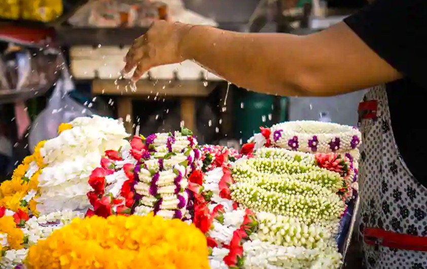 Colorful floral garlands crafted at K.R. Flower Market in Bangalore, Karnataka, India showcase traditional craftsmanship, fresh jasmine, rose petals, marigold strands, textures and cultural heritage. Colorful floral garlands crafted at K.R. Flower Market in Bangalore, Karnataka, India showcase traditional craftsmanship, fresh jasmine, rose petals, marigold strands, textures and cultural heritage.