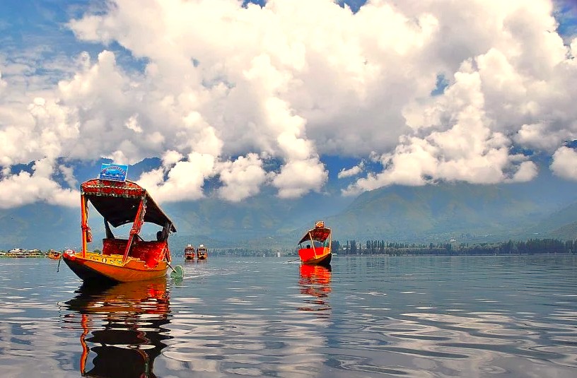 Colorful shikara boats on Dal Lake offer scenic tours near Lal Chowk, celebrating the natural and UNESCO Creative Arts heritage of Srinagar, Jammu and Kashmir, India. Colorful shikara boats on Dal Lake offer scenic tours near Lal Chowk, celebrating the natural and UNESCO Creative Arts heritage of Srinagar, Jammu and Kashmir, India.