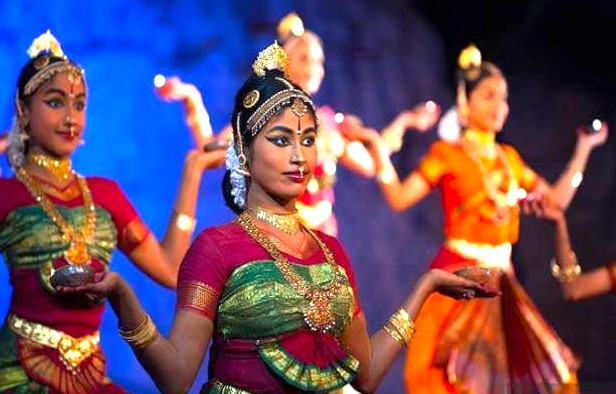 Vibrant classical dancers from India in traditional attire perform Bharatanatyam and Odissi at a cultural festival before the iconic Lotus Temple, New Delhi, showcasing heritage, temple architecture, tourism, and spirituality. Vibrant classical dancers from India in traditional attire perform Bharatanatyam and Odissi at a cultural festival before the iconic Lotus Temple, New Delhi, showcasing heritage, temple architecture, tourism, and spirituality.