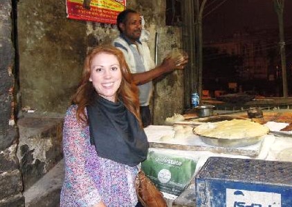 Candid street food vendor prepares fresh flatbread fragrant masala chai at a bustling evening roadside stall beside the India-Lotus Temple, New Delhi, inviting tourists and locals to savor authentic flavors. Candid street food vendor prepares fresh flatbread fragrant masala chai at a bustling evening roadside stall beside the India-Lotus Temple, New Delhi, inviting tourists and locals to savor authentic flavors.
