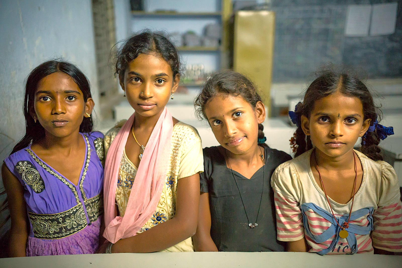 A portrait of young local girls in Karnataka, India, representing the community near the Mallikarjuna Temple in Badami and the Pattadakal-UNESCO heritage site. A portrait of young local girls in Karnataka, India, representing the community near the Mallikarjuna Temple in Badami and the Pattadakal-UNESCO heritage site.