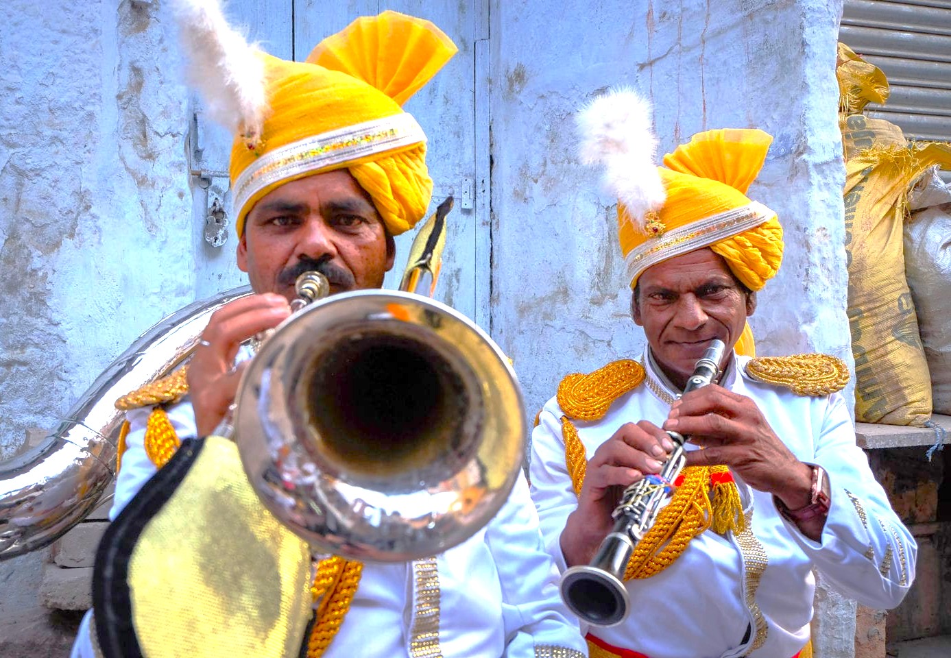 Two traditionally attired musicians play trumpet and clarinet at Mandore Gardens in Jodhpur, Rajasthan, India, showcasing vibrant folk ensemble, ceremonial festivity, Marwari cultural heritage and iconic historic garden landscape tourism. Two traditionally attired musicians play trumpet and clarinet at Mandore Gardens in Jodhpur, Rajasthan, India, showcasing vibrant folk ensemble, ceremonial festivity, Marwari cultural heritage and iconic historic garden landscape tourism.
