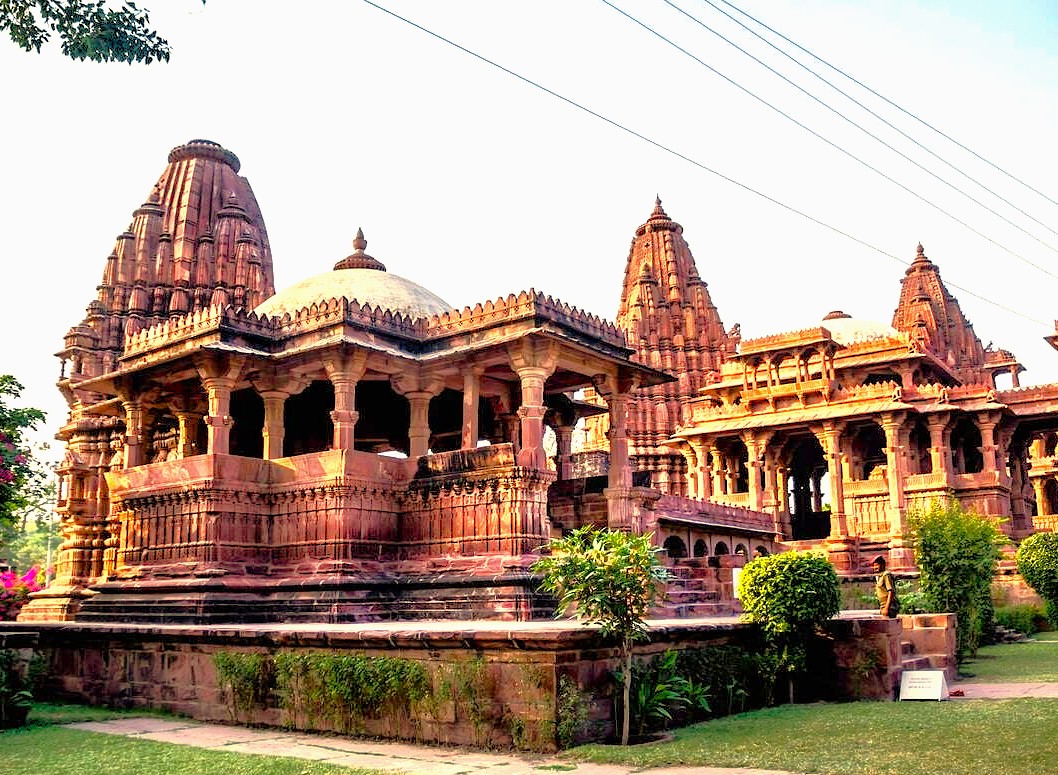 Mandore Gardens Jodhpur Rajasthan. Home to a variety of artifacts and sacred sites that reflect Jodhpur's storied past. Among the most striking features are the Chhatris, intricately carved cenotaphs that commemorate the kings and queens of the Rathore Dynasty. Each structure is distinct, revealing exceptional craftsmanship that reveals much about the artistry of the period. For instance, the Chhatri of Maharaja Ajit Singh, constructed in 1793, features floral motifs and delicate carvings.  Home to a variety of artifacts and sacred sites that reflect Jodhpur's storied past. Among the most striking features are the Chhatris, intricately carved cenotaphs that commemorate the kings and queens of the Rathore Dynasty. Each structure is distinct, revealing exceptional craftsmanship that reveals much about the artistry of the period. For instance, the Chhatri of Maharaja Ajit Singh, constructed in 1793, features floral motifs and delicate carvings. Mandore Gardens Jodhpur Rajasthan. Home to a variety of artifacts and sacred sites that reflect Jodhpur's storied past. Among the most striking features are the Chhatris, intricately carved cenotaphs that commemorate the kings and queens of the Rathore Dynasty. Each structure is distinct, revealing exceptional craftsmanship that reveals much about the artistry of the period. For instance, the Chhatri of Maharaja Ajit Singh, constructed in 1793, features floral motifs and delicate carvings.  Home to a variety of artifacts and sacred sites that reflect Jodhpur's storied past. Among the most striking features are the Chhatris, intricately carved cenotaphs that commemorate the kings and queens of the Rathore Dynasty. Each structure is distinct, revealing exceptional craftsmanship that reveals much about the artistry of the period. For instance, the Chhatri of Maharaja Ajit Singh, constructed in 1793, features floral motifs and delicate carvings.