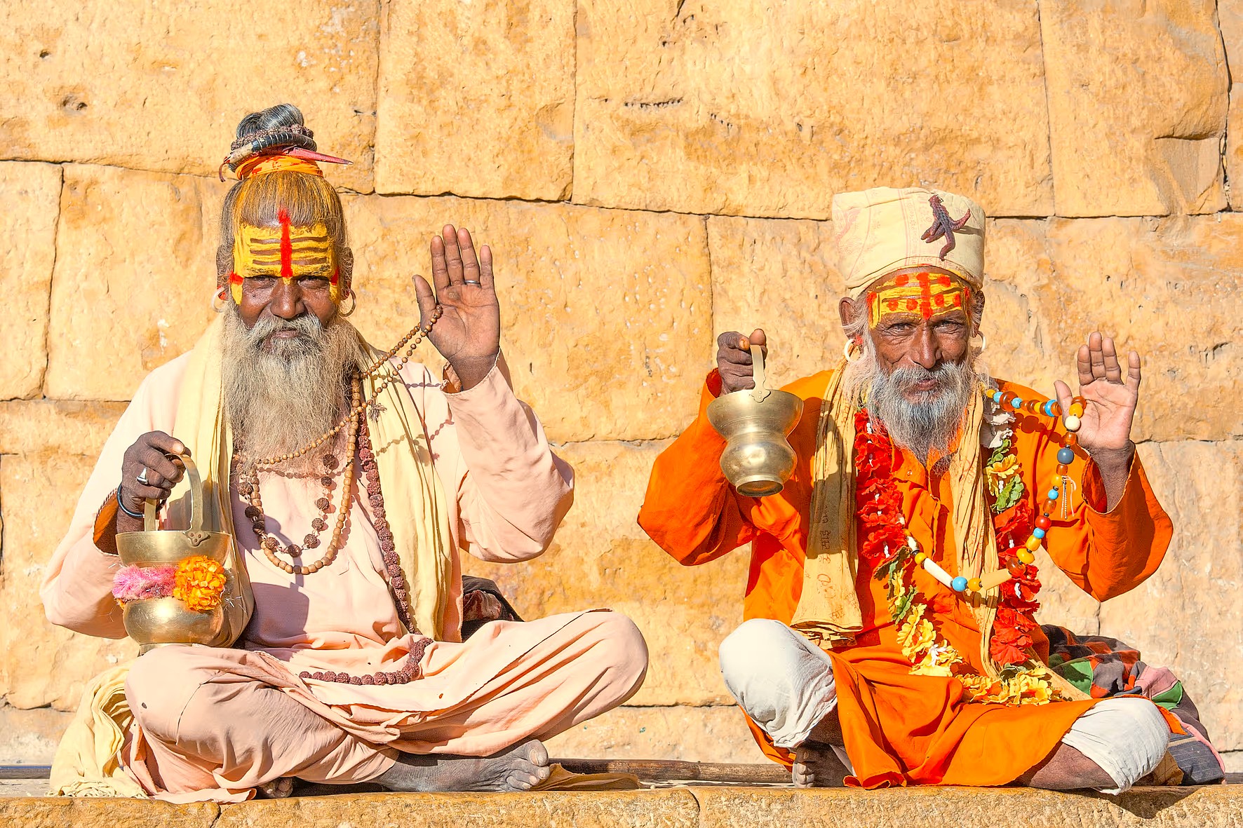 Two brightly robed Hindu Sadhus offer blessings, symbolizing the spiritual heart of Agra, India, found near the Marble Cottage, UNESCO Taj Mahal, and Keoladeo National Park. Two brightly robed Hindu Sadhus offer blessings, symbolizing the spiritual heart of Agra, India, found near the Marble Cottage, UNESCO Taj Mahal, and Keoladeo National Park.