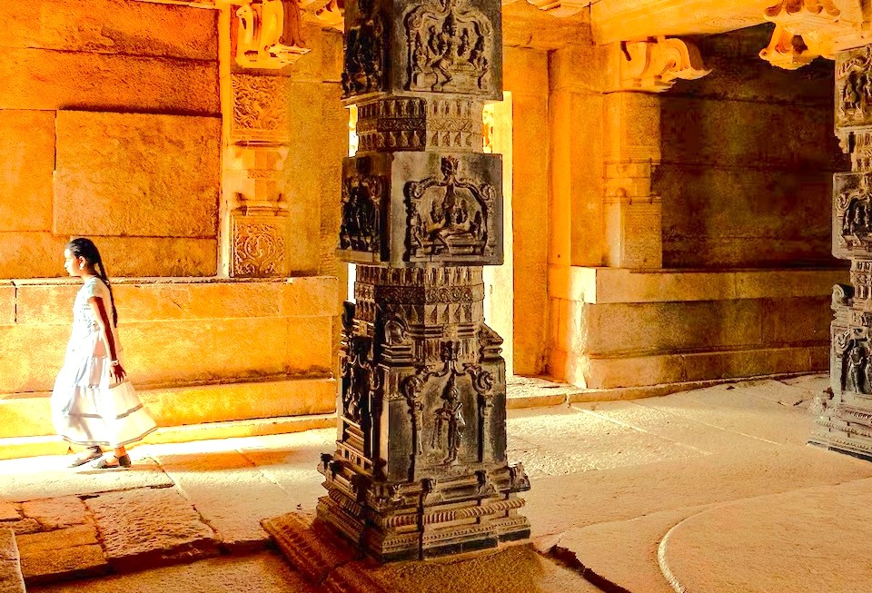 A young tourist's quiet walk through Meenakshi Temple in Madurai, Tamil Nadu, forges a personal relationship with India's ancient history, a key experience for travelers who also explore Munnar and the nearby Unesco Western Ghats. A young tourist's quiet walk through Meenakshi Temple in Madurai, Tamil Nadu, forges a personal relationship with India's ancient history, a key experience for travelers who also explore Munnar and the nearby Unesco Western Ghats.