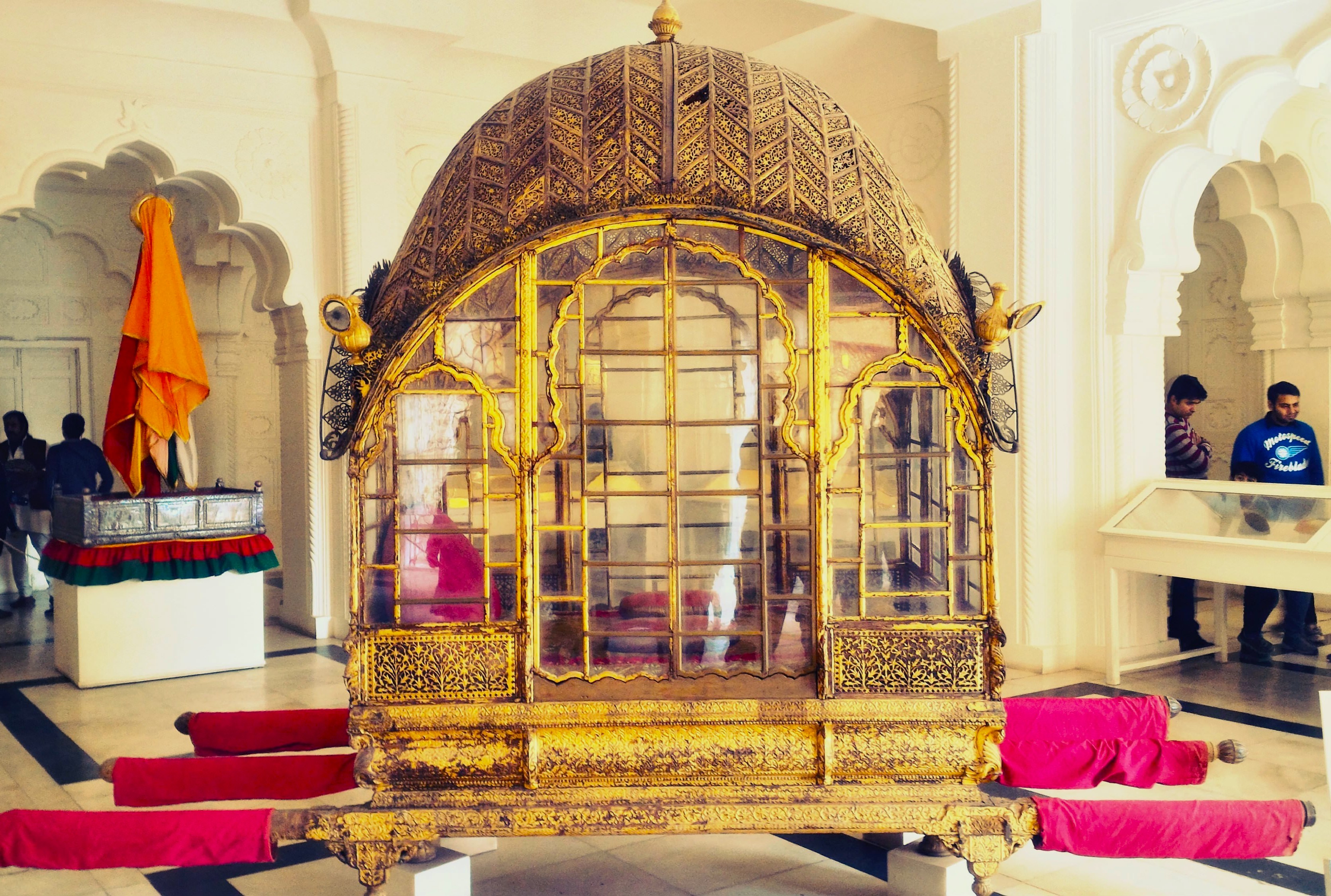 Richly ornamented royal palanquin at Mehrangarh Fort Museum, Jodhpur, Rajasthan, India, showcases exquisite Rajasthani craftsmanship, heritage décor, traditional architecture, iconic cultural tourism attraction, historical artifact, perfect for travel photography enthusiasts. Richly ornamented royal palanquin at Mehrangarh Fort Museum, Jodhpur, Rajasthan, India, showcases exquisite Rajasthani craftsmanship, heritage décor, traditional architecture, iconic cultural tourism attraction, historical artifact, perfect for travel photography enthusiasts.