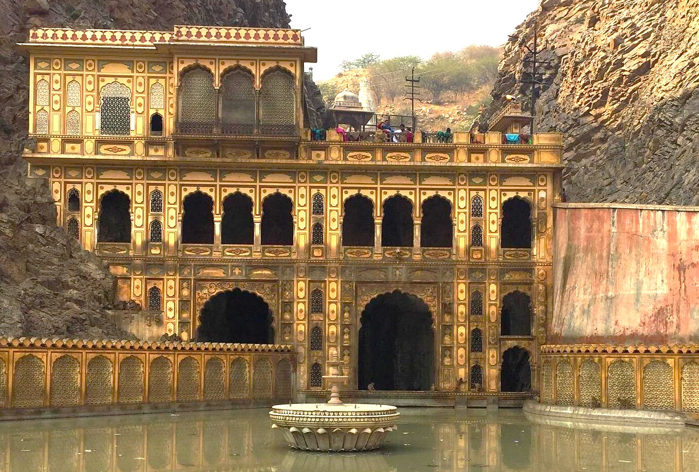 At Galta Ji Monkey Temple in Jaipur, Rajasthan, India, centuries-old sandstone pavilions and spring-fed pools welcome playful rhesus macaques, inviting visitors to witness sacred wildlife interactions amid serene mountain surroundings. At Galta Ji Monkey Temple in Jaipur, Rajasthan, India, centuries-old sandstone pavilions and spring-fed pools welcome playful rhesus macaques, inviting visitors to witness sacred wildlife interactions amid serene mountain surroundings.