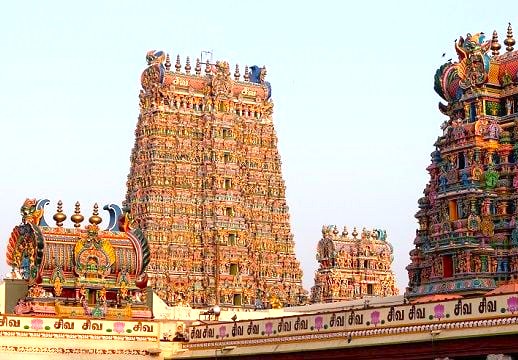 Majestic Mottai Gopuram at Meenakshi Temple in Madurai, Tamil Nadu, exemplifies South India’s Dravidian temple architecture with intricately carved deities, vibrant stucco figures, centuries-old cultural symbolism, and enduring pilgrimage heritage. Majestic Mottai Gopuram at Meenakshi Temple in Madurai, Tamil Nadu, exemplifies South India’s Dravidian temple architecture with intricately carved deities, vibrant stucco figures, centuries-old cultural symbolism, and enduring pilgrimage heritage.