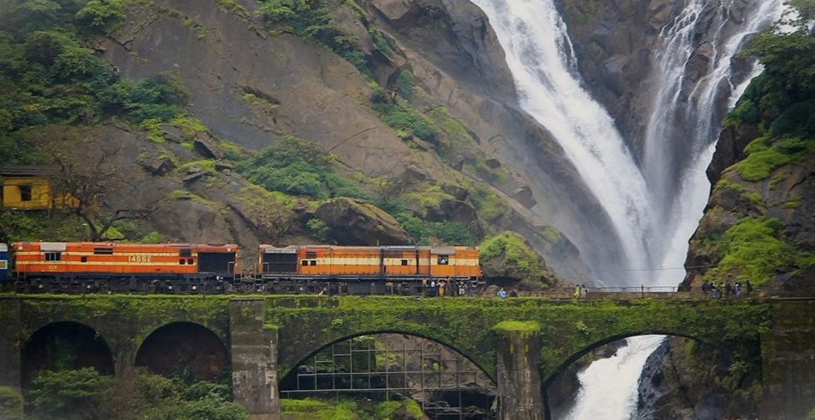 Scenic railway journey from Goa to Mumbai in Mahapradesh, India, traverses lush Konkan coast mountains, tunnels and pristine coastline vistas, offering travelers breathtaking landscapes and cultural experiences aboard coastal express. Scenic railway journey from Goa to Mumbai in Mahapradesh, India, traverses lush Konkan coast mountains, tunnels and pristine coastline vistas, offering travelers breathtaking landscapes and cultural experiences aboard coastal express.