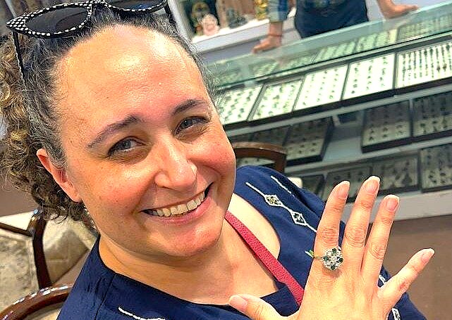 A tourist tries on a ring in Mysore, India, near Mysore Palace, a Karnataka city often visited by tourists exploring Bangalore and the Tipu Sultan Palace ('Tiger of Mysore').