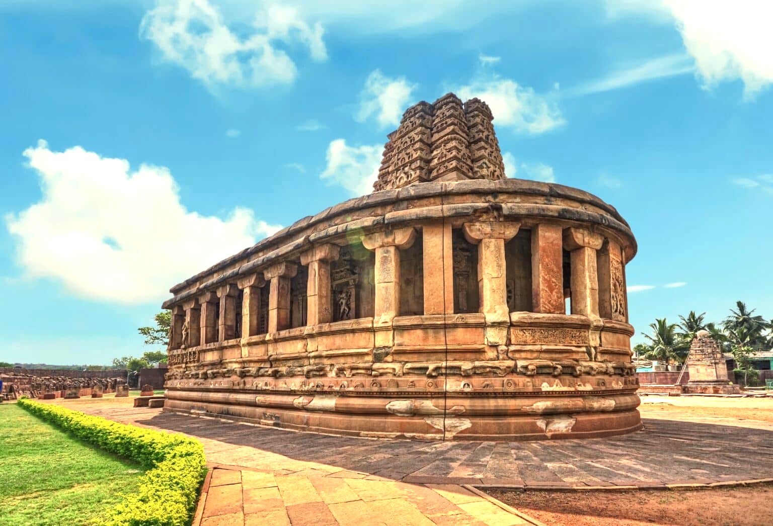 The unique apsidal Durga Temple in Aihole, Karnataka, India, part of a complex near the Ravana Pralad Cave Temple, Badami, and the Pattadakal UNESCO site. The unique apsidal Durga Temple in Aihole, Karnataka, India, part of a complex near the Ravana Pralad Cave Temple, Badami, and the Pattadakal UNESCO site.