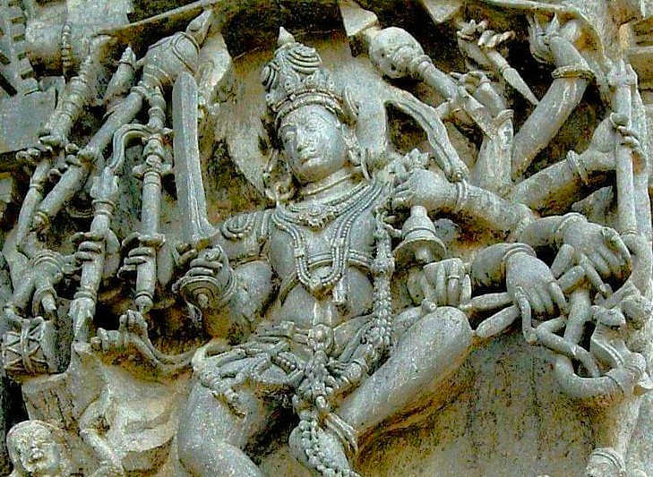 Multi-armed stone sculpture of Lord Shiva adorned with intricate jewelry and symbolic motifs, showcased at Patteeswara Temple in Coimbatore, Tamil Nadu, India’s revered heritage site. Multi-armed stone sculpture of Lord Shiva adorned with intricate jewelry and symbolic motifs, showcased at Patteeswara Temple in Coimbatore, Tamil Nadu, India’s revered heritage site.