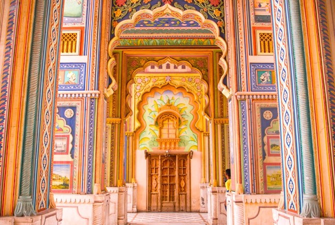Vibrant carved arches and ornate pillars of Patrika Gate in Jaipur, Rajasthan, India showcase traditional Rajasthani artistry, Mughal-inspired motifs, cultural heritage landmark, premier travel destination, iconic photography spot for tourists.