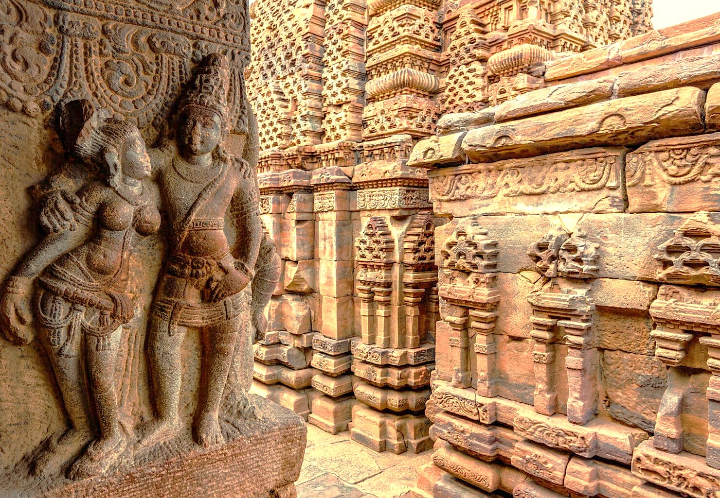 Intricate stone carvings of deities at the Pattadakal UNESCO site in Karnataka, India, a key location near the Ravana Pralad Cave Temple in Aihole and Badami. Intricate stone carvings of deities at the Pattadakal UNESCO site in Karnataka, India, a key location near the Ravana Pralad Cave Temple in Aihole and Badami.