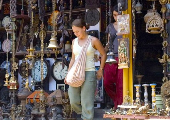 Tourist browsing vintage clocks, lamps and ornate décor at a bustling antiques market on Princess Street, Kochi in Kerala, South India, showcasing local craftsmanship, cultural heritage and vibrant shopping experience. Tourist browsing vintage clocks, lamps and ornate décor at a bustling antiques market on Princess Street, Kochi in Kerala, South India, showcasing local craftsmanship, cultural heritage and vibrant shopping experience.