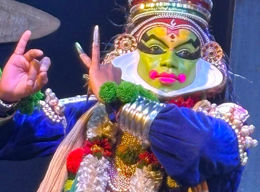 Close-up of a vibrantly painted performer with ornate jeweled adornments at a lively cultural festival in Punarjarni Village, Munnar, Kerala, Southern India. Close-up of a vibrantly painted performer with ornate jeweled adornments at a lively cultural festival in Punarjarni Village, Munnar, Kerala, Southern India.