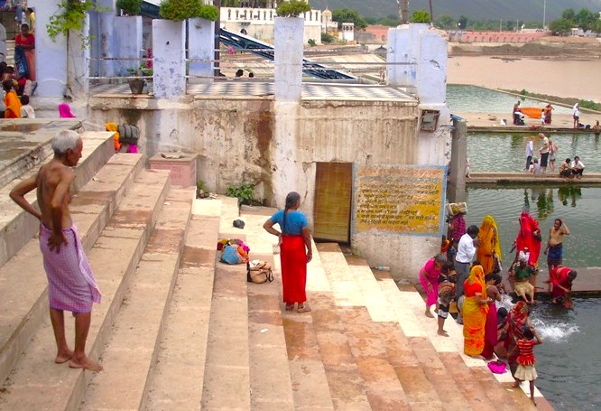 Serene dawn at Pushkar Ghats in Rajasthan, India, shows pilgrims bathing on stone steps beside the lake, framed by Aravalli hills between Jaipur and Agra en route to Taj Mahal. Serene dawn at Pushkar Ghats in Rajasthan, India, shows pilgrims bathing on stone steps beside the lake, framed by Aravalli hills between Jaipur and Agra en route to Taj Mahal.