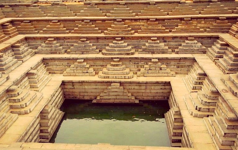 SEO-create a 30 word sentance-SEO high ranking key word Alt Text association - relationship - key words for the subject or nearby Key words-place-combine and create one sentance -include :-  India, Karnataka, Hampi, Elephant stables, queens baths, Unesco