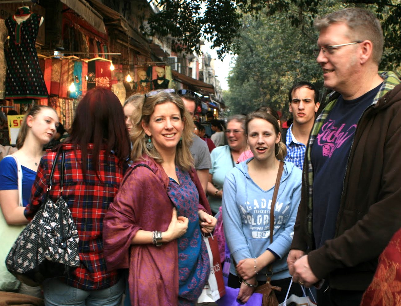  A group of tourists chats and shops at an outdoor market in Bikaner, Rajasthan, India, celebrating the end of their railway journey from Delhi to Bikaner into the Thar Desert.