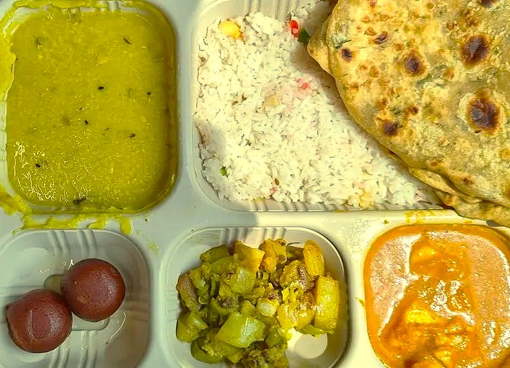 A traditional Indian thali meal served on the railway journey from Goa to Mumbai, India. This route connects Goa, near Karnataka and the Old Goa St. Francis Church UNESCO churches, to Mumbai, home of the UNESCO Elephanta Caves. A traditional Indian thali meal served on the railway journey from Goa to Mumbai, India. This route connects Goa, near Karnataka and the Old Goa St. Francis Church UNESCO churches, to Mumbai, home of the UNESCO Elephanta Caves.