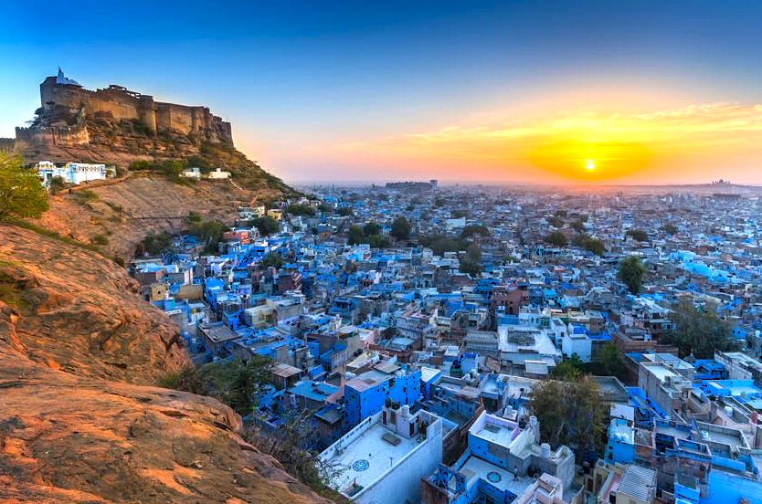 Admire the panoramic sunset view of Jodhpur and Mehrangarh Fort in Rajasthan, India, a stunning highlight on a heritage road trip connecting to Jaipur and nearby UNESCO World Heritage sites. Admire the panoramic sunset view of Jodhpur and Mehrangarh Fort in Rajasthan, India, a stunning highlight on a heritage road trip connecting to Jaipur and nearby UNESCO World Heritage sites.